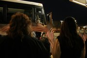 Workers at Kansas City International Airport greeted veterans arriving from Lyndon with American flags before their April 30 Honor Flight to Washington, D.C.