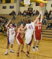 Jeremy Carlisle attempts a reverse layup against Wellsville during the fourth quarter of Tonganoxie's 52-37 victory on Friday afternoon.