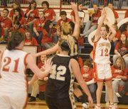 Tonganoxie High junior Abby Eisman follows through on a jump shot during the Chieftains' 48-28 victory against Turner at THS on Tuesday night.