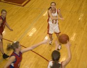 Abby Eisman moves the ball around the perimeter for Tonganoxie. The Chieftains had eight players score in their sub-state win over Hiawatha.