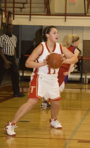 Roni Grizzle looks at her outlet options after grabbing a rebound during the Chieftains' 34-point sub-state win at home on Tuesday.