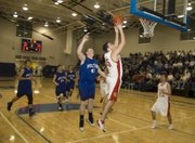 Keaton Schaffer scores a pair of his eight fast-break points for Tonganoxie during the Chieftains' win against Holton.