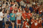 Tonganoxie High fans erupt after Austin Smith's dunk in the closing moments of the Chieftains' victory over Holton.