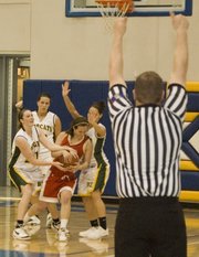 Chrissie Jeannin is tied up by Basehor-Linwood defenders during Tonganoxie's sub-state semifinal loss to Basehor-Linwood on Friday.