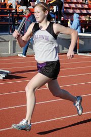 Baldwin High School junior Connor Twombly sprints to the finish of the girls' 3,200-meter relay. BHS placed third in the race.