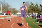 Baldwin High School senior Connor Wright smiles as he cruises across the finish line in first place. Wright helped the boys' team win the 3,200-meter relay. He also won the 800-meter run later in the night.