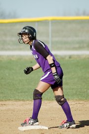 Baldwin High School senior Haley Finucane carefully watches the Wellsville pitcher as she stands on second base during the Bulldogs' 10-0 win last week.