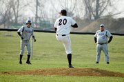 Baldwin High School sophomore Josh Hoffman leads off third base while the Ottawa pitcher winds up. Coach Brock Hartshorn was coaching third base.