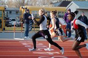 Baldwin High School sophomore Myranda Behrens sprints ahead of Eudora and Lansing runners as she finishes the 400-meter relay in first place.