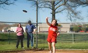 Jo Kissinger throws the discuss a personal best record of 80 feet 9 inches during the Tonganoxie Middle School track meet Thursday.