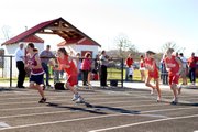 Tonganoxie MIddle School runners Perla Mendoza, Abby Thomas and Madee Walker take off at Tonganoxie's dual.