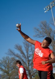 Ty Barton, Tonganoxie MIddle School eighth-grader, throws the shot put. He finished second in the event at the TMS dual.