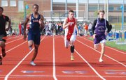 DJ Lindsay runs the 100-meter dash on Friday at Gardner. Lindsay set a new Tonganoxie High record in the 200 at the Blazer Invitational.
