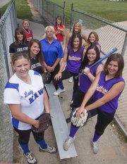 Pictured are the members of this year’s All-Area Softball Team. Surrounding coach Jill Larson-Bradney of Perry-Lecompton are, clockwise from front left: Courtney Kasson, Perry-Lecompton; Rosie Hull and Maggie Hull, Free State; Hailie Rae, Ottawa; Lauren Himpel, Tonganoxie; Alex Zordel, Baldwin; and Kendall Patterson, Missy Rome, Lezley Lawson and Kaley Patterson, McLouth.
