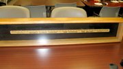 Donna Graf’s infamous and heavily-worn yardstick was encased and also retired during Graf’s retirement party.