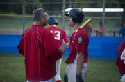 Post 41 coach Gary Wagner talks with Kyle Newton in the middle of the fourth inning on Tuesday night at Leavenworth. Newton went 5-for-5 in Tonganoxie's 9-8 defeat of Easton in the Post 23 League championship game.