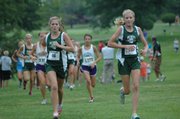 Beth Reichenberger, left, and Lacey Erickson, right, run in De Soto’s first cross country meet of the year at Anderson County. Reichenberger finished sixth with a time of 17:04 and Erickson finished first with a time of 16:03. The De Soto girls finished second overall.