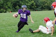 Baldwin Junior High School eighth grader Skyler Shockley returns Ottawa's kick off in the second quarter.