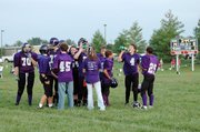 Members of the Baldwin Junior High School eighth grade football team take a moment to rest and drink water during a timeout Tuesday evening. BJHS beat Ottawa 14-8 to improve its record to 2-0 on the season.