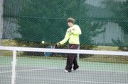 Baldwin High School junior Michaela Krysztof hits a ball over the net during her doubles' match Saturday.