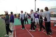 Baldwin High School players and coaches celebrate Monday's victory after the final horn sounded in Coffeyville.