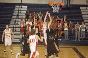 THS sophomore center Dane Erickson puts up a shot inside during the Chieftains' 61-44 victory over K.C. East (Mo.) on Monday night at the Cardinal Invitational. Erickson scored 13 points in his varsity debut.