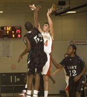 Keaton Schaffer shoots over an East defender during Tonganoxie's 61-44 win at Eudora on Monday night.