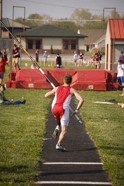 Jake Willis prepares to take one of his early pole vault attempts Thursday afternoon before he won the event with a mark of 12-6. The Tonganoxie boys finished second at the Tonganoxie Invitational.