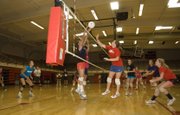 Haley Smith blocks a play made by Jo Kissinger on Thursday afternoon at Tonganoxie High volleyball camp.