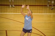 Sagan Scates prepares herself to set the ball for a teammate on Wednesday at Tonganoxie volleyball camp.