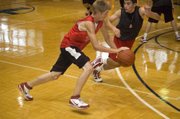 Tonganoxie High guard Ben Williams looks for a driving angle against Lansing on June 23 at Rockhurst University in Kansas City, Mo.