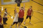 Brady Waldeier crashes the offensive glass against Shawnee Mission South in one of Tonganoxie's games at Rockhurst on June 23.
