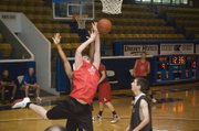Dane Erickson draws contact in the paint while going up for a shot attempt against Lansing on June 23 at Rockhurst University in Kansas City, Mo.