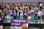 Baldwin High School students cheer on their football team at Friday's season-opening contest in Paola. The Bulldogs won 32-14 over the Panthers.