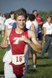 THS senior Keith Slater begins to make his final turn toward the finish line on Tuesday at the Tonganoxie Invitational.