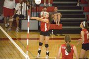Hannah Kemp sends a pass to the center of the court on Tuesday night against Lansing High. Tonganoxie lost to LHS, ranked No. 3 in Class 5A by the Kansas Volleyball Association, in straight sets.