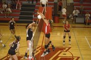 THS senior Molly O'Hagan stymies a Lansing spike on Tuesday night. The Chieftains lost to LHS in straight games at a home triangular.