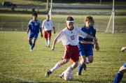 THS senior Quinten Olson pushes the ball up the sideline in the Chieftains' 1-0 home loss to Leavenworth on Thursday.