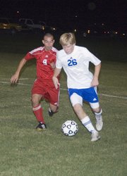Joseph Parrino chases down a Perry-Lecompton player on Monday in the Chieftains' 2-1 road playoff win.