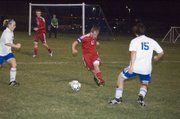 Matt Briggs clears the ball for the Tonganoxie High defense in the first half of the Chieftains’ 2-1 road playoff win Monday night at Perry-Lecompton.