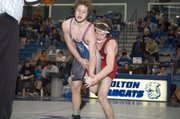 Tonganoxie High senior 125-pounder Justin Soetaert wrestles St. James Academy's Andrew Tujague in a consolation quarterfinal Saturday at the Class 4A regional at Holton. Soetaert scored two points in the final seconds of the third period for a 5-4 win.