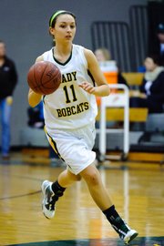Basehor-Linwood senior point guard Courtney Poe leads the offensive attack during the Bobcats' substate victory against Jefferson County West.