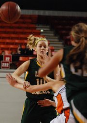 Basehor-Linwood guard Macyn Sanders fires a pass to teammate Amanda O'Bryan during the first half of the Bobcats' 37-28 victory against Colby at the state tournament.
