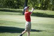 THS junior Kody Campbell watches his shot travel out of some light rough on Monday at a regional golf tournament in Kansas City, Kan. Campbell finished with a 90.