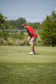 THS junior Tanner Hale watches a putt roll toward the hole on Monday at Dub’s Dread Golf Club. Hale was one of three Tonganoxie golfers to finish in the top 10 at Class 4A regional tournament. His score of 84 was good enough for eighth place.