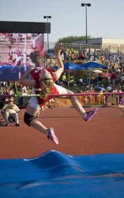 Chieftains freshman Haley Griffin, who came one spot away from winning a state medal in the high jump, heads over the bar Friday evening while her jump is being shown on the Cessna Stadium video board. Griffin finished eighth with a mark of 4 feet, 10 inches.