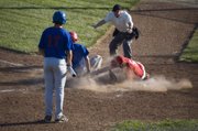 Wellsville scores a run on a wild pitch as Post 41 starting pitcher Dylan Fosdick covers the plate in the top of the fourth inning Tuesday night at Eisenhower Park in Kansas City, Kan. Tonganoxie's season ended with an 8-6 loss to Wellsville at the Class AA Zone 2 tournament.