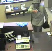 Authorities are looking for this man, captured on surveillance tape July 25 while robbing the Bank of Blue Valley, 5520 Hedge Lane Terrace in Shawnee.