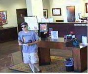 The FBI believes this man — captured on surveillance video prior to donning a disguise — may be responsible for a July 25 bank robbery in Shawnee, as well as four Oklahoma heists and one in Joplin, Mo.