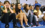 Trailridge Middle School seventh-graders Paul Cooper, Itiel Cifuentes, Rochelle Rivera, Jaebriel Francis and Briana Moye respond to a chant during Monday's orientation assembly.